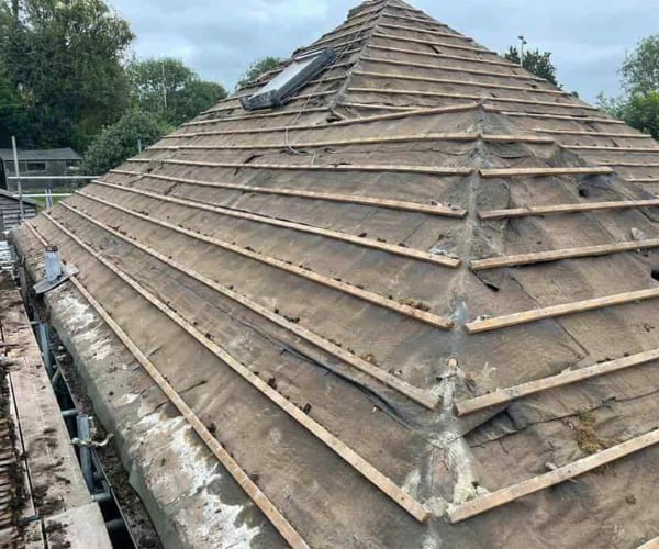 This is a photo of a hip roof that has been stripped back to the battens, and is awaiting a new roof covering to be installed. Works carried out by LKP Roofing Thorne